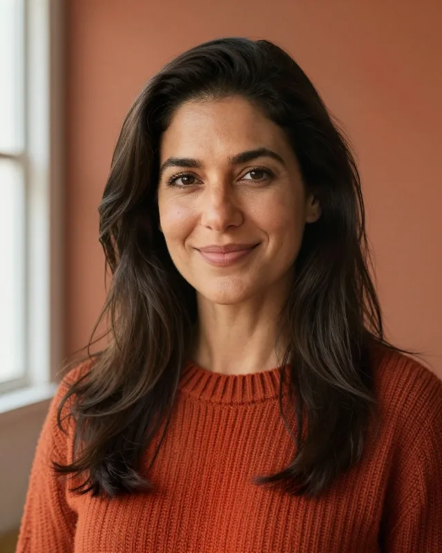 Portrait of Mara, a woman in her late thirties with long dark wavy hair